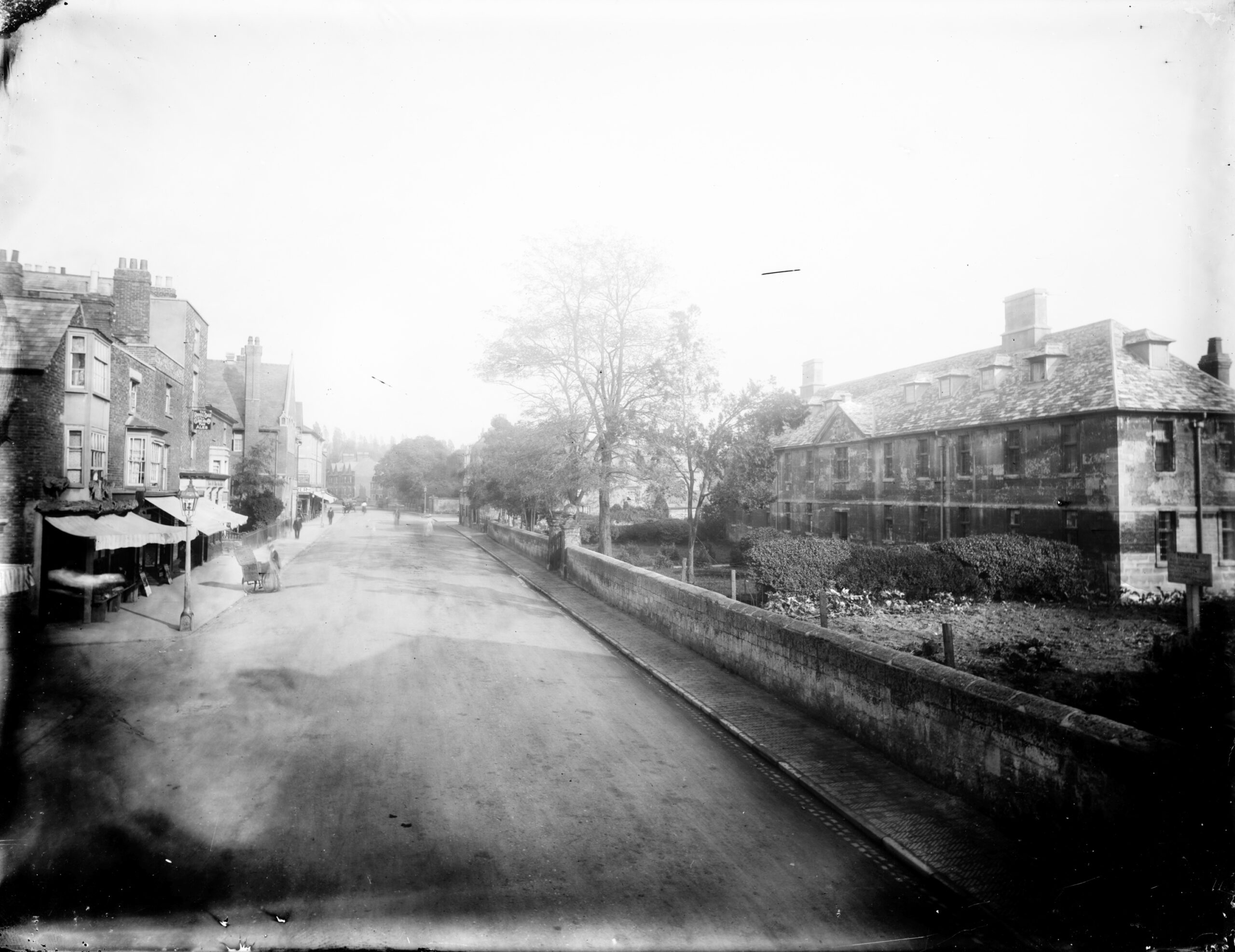 exterior view looking along the street with stones almshouses in the foreground. oxfordshire oxford oxford